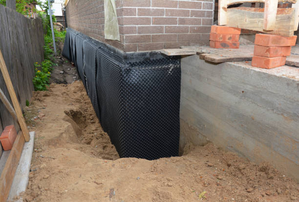 Happy homeowners after waterproofing job in North Rose